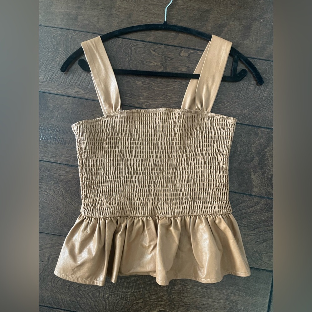 Shirred, leather like tank peplum top.
